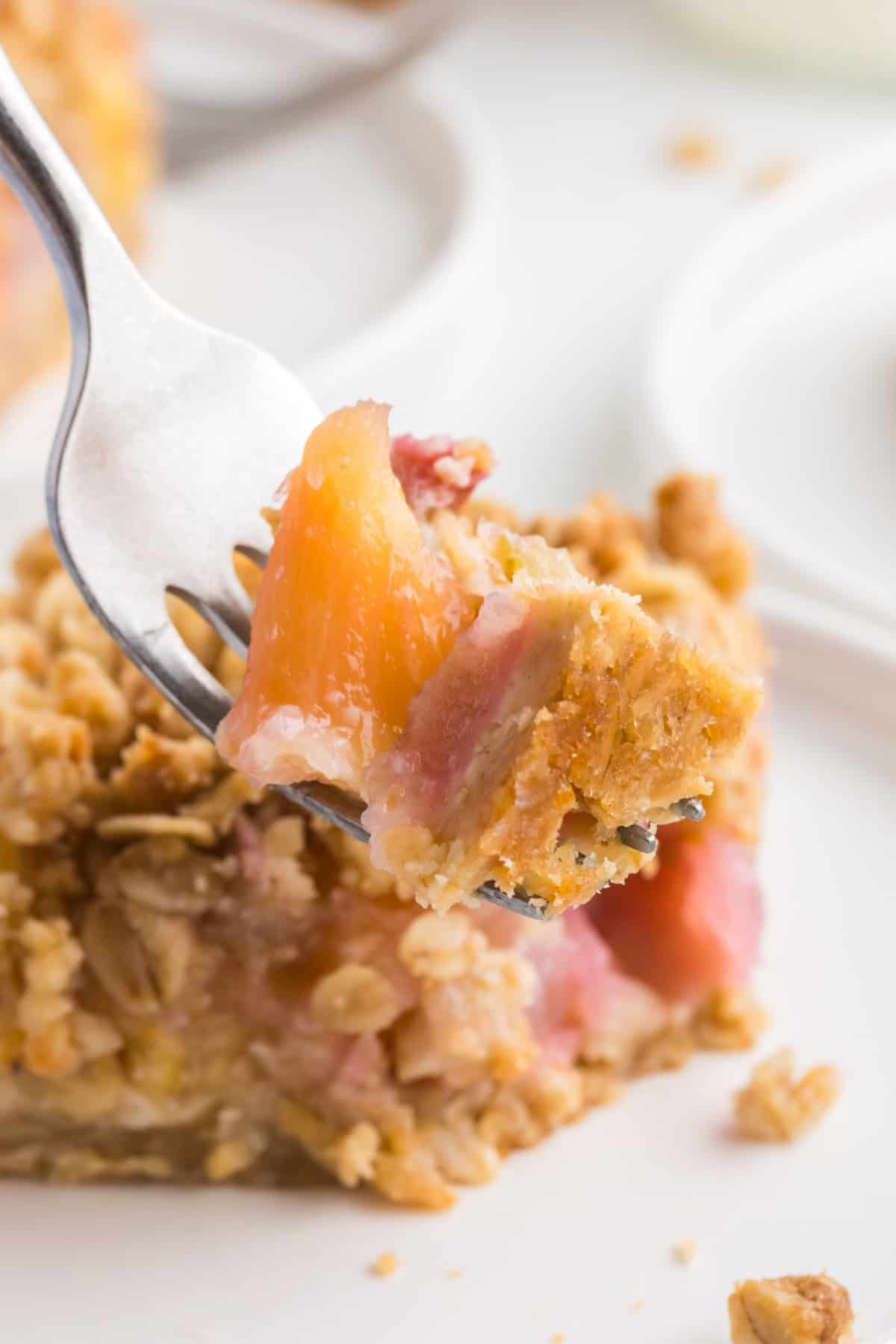Pineapple rhubarb bars on a fork.