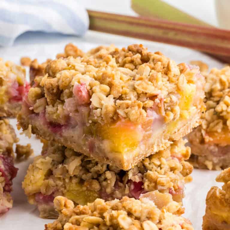 A stack of pineapple rhubarb dream bars.