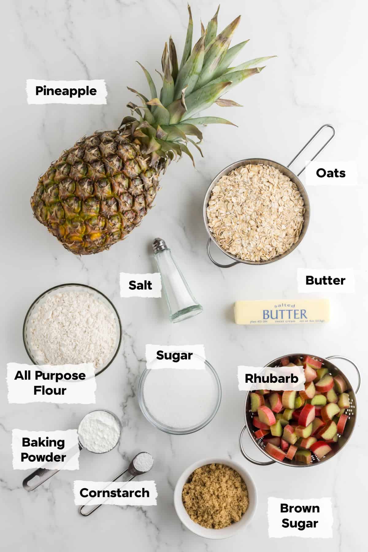 Ingredients on a table to make pineapple rhubarb crumble bars.