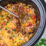 Cooked Slow Cooker Stuffed Pepper Casserole in a crockpot dish.
